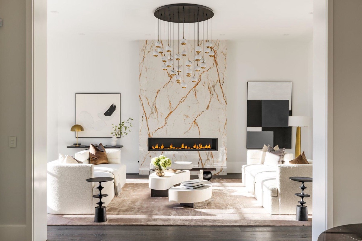 Great room rebuilt around a full height marble fireplace wall